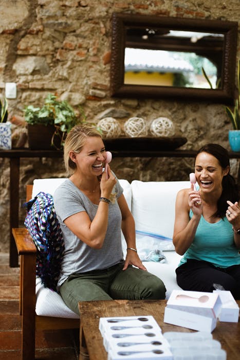 Women laughing using PMD Clean products