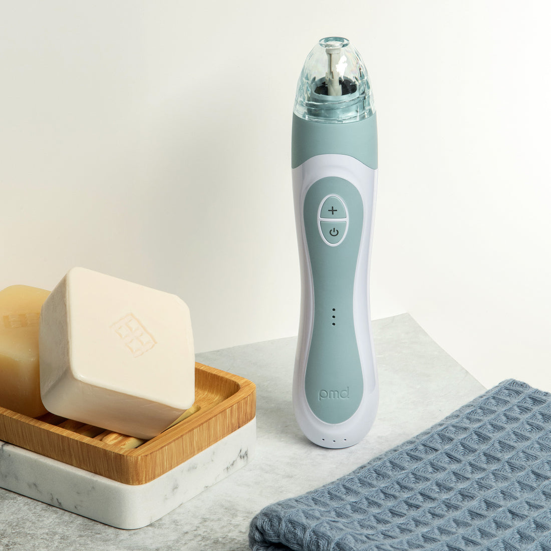 PMD Beauty Personal Microderm Elite Pro at-home microdermabrasion device with 3 luxe caps, 3 speed settings, 3 suction options, and cordless rechargeable design for professional-level skin exfoliation and radiant skin.