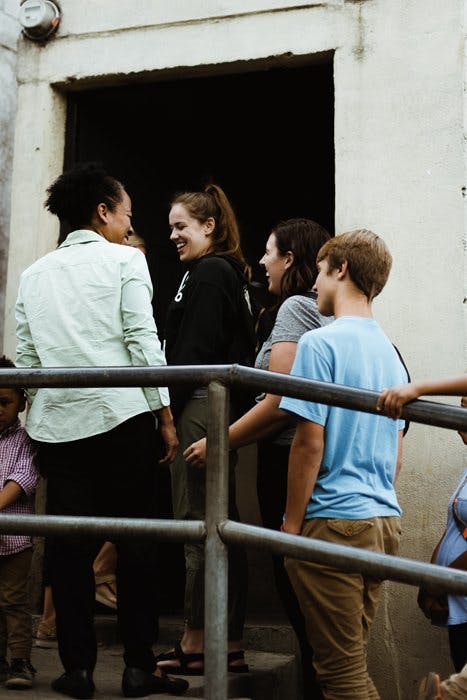 People waiting in line on a staircase. 