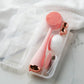 4003-Case?PMD Clean Body Case next to towel with blush PMD Clean Body and accessories inside