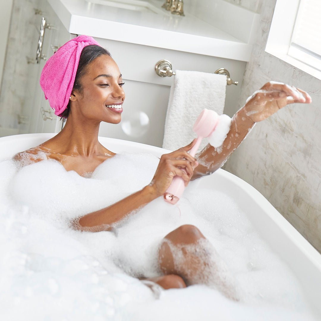 AT-4003-LBlush?Woman in bath using PMD Clean Body 