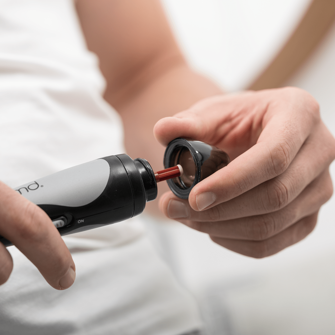 hover-image?Man placing red disc on PMD Man device