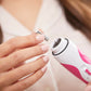 1803?Woman placing grey replacement disc on Pink Personal Microderm Pro
